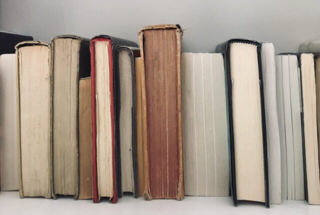 a stack of books on a shelf